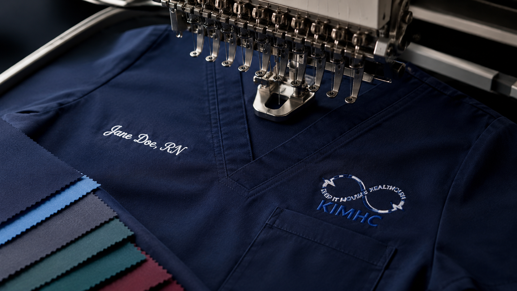 KIMHC navy scrub embroidery and fabric detail