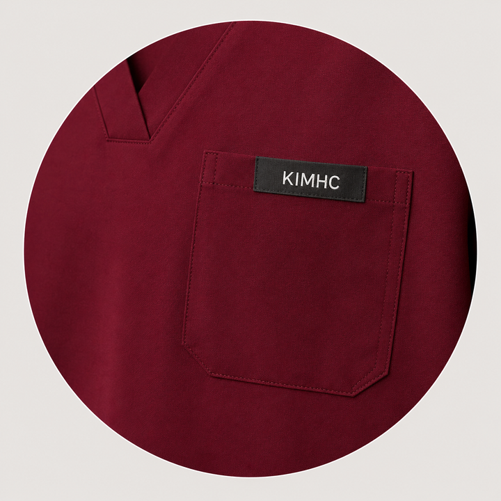 The Vital Jogger in Bloodline Burgundy — one chest pocket with woven KIMHC tag