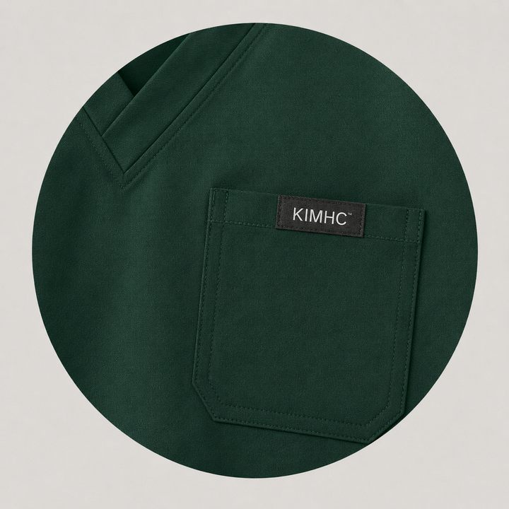 The Vital Jogger in Nightfall Dark Green — one chest pocket with woven KIMHC tag